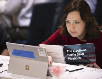 Mandy Vigil, from New Mexico, works during an exercise run by military and national security officials, for state and local election officials to simulate different scenarios for the 2020 elections, Monday, Dec. 16, 2019, in Springfield, Va. (Alex Brandon/AP Photo)