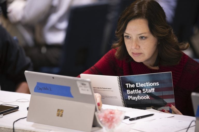 Mandy Vigil, from New Mexico, works during an exercise run by military and national security officials, for state and local election officials to simulate different scenarios for the 2020 elections, Monday, Dec. 16, 2019, in Springfield, Va. (Alex Brandon/AP Photo)