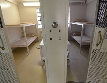 Cells are shown in a cleared prison wing.