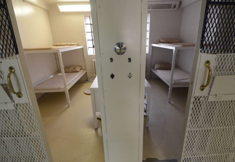 Cells are shown in a cleared prison wing.