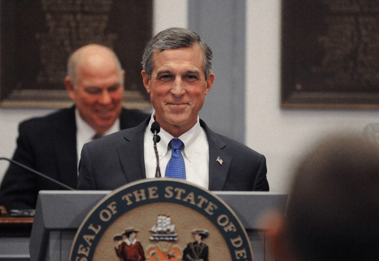 Delaware Governor John Carney grins during his 2020 State of the State address at Legislative Hall in Dover, Delaware on Thursday, Jan. 23, 2020.  (Butch Comegys for WHYY)