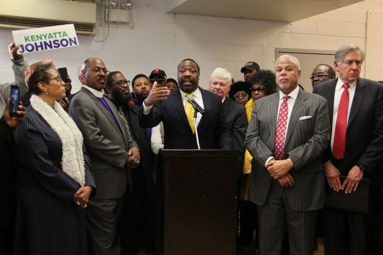 Philadelphia City Councilman Kenyatta Johnson is surrounded by supporters at a press conference where he declares his innocence after the announcement on Wednesday of federal corruption charges against him and his wife. (Emma Lee/WHYY)