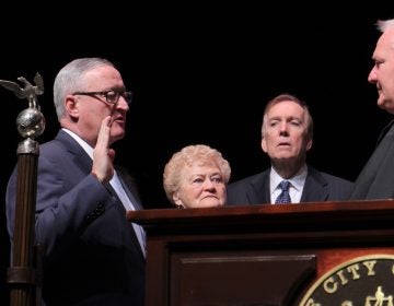 Mayor Jim Kenney is sworn in to his second term, flanked by his mother, Barbara. (Emma Lee/WHYY)