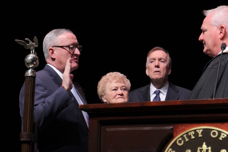 Mayor Jim Kenney is sworn in to his second term, flanked by his mother, Barbara. (Emma Lee/WHYY)