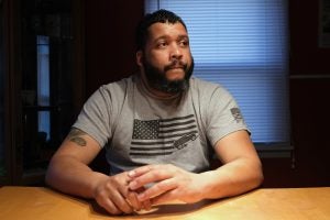 Ronald Stanley Webb, Jr, nicknamed Stosh, talks while in his home Jan. 16, 2020, in Deer Lake, Pennsylvania. Webb was subjected to a racial slur while at Port Clinton Fire Company. (Matt Smith for Keystone Crossroads)