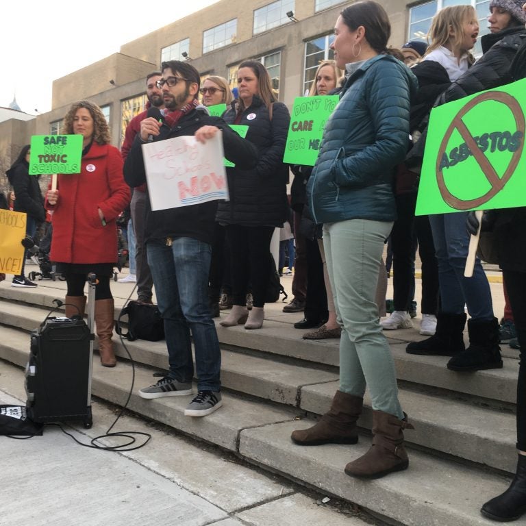 Franklin Learning Center teacher Lou Fantini speaks at a rally before the start of Thursday's Board of Education meeting. (The Notebook)