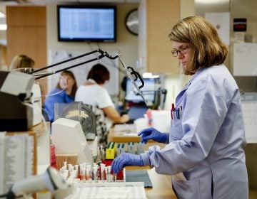 Women got the lion's share of new jobs in December and now outnumber men on U.S. payrolls. This unusual situation reflects the growth of industries like health care where women dominate. (John Minchillo/AP Photo)