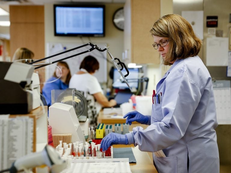 Women got the lion's share of new jobs in December and now outnumber men on U.S. payrolls. This unusual situation reflects the growth of industries like health care where women dominate. (John Minchillo/AP Photo)