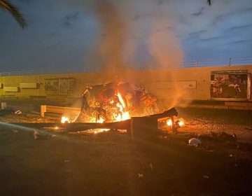 A vehicle burns at Baghdad International Airport following an airstrike in Baghdad on Friday. The Pentagon said the U.S. operation killed Gen. Qassem Soleimani, the head of Iran's elite Quds Force.
(Iraqi Prime Minister Press Office via AP)