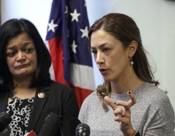 Rep. Pramila Jayapal, D-Wash., looks on as Negah Hekmati talks about her hours-long delay returning to the U.S. from Canada with her family days earlier, at a news conference on Monday. (Elaine Thompson/AP Photo)