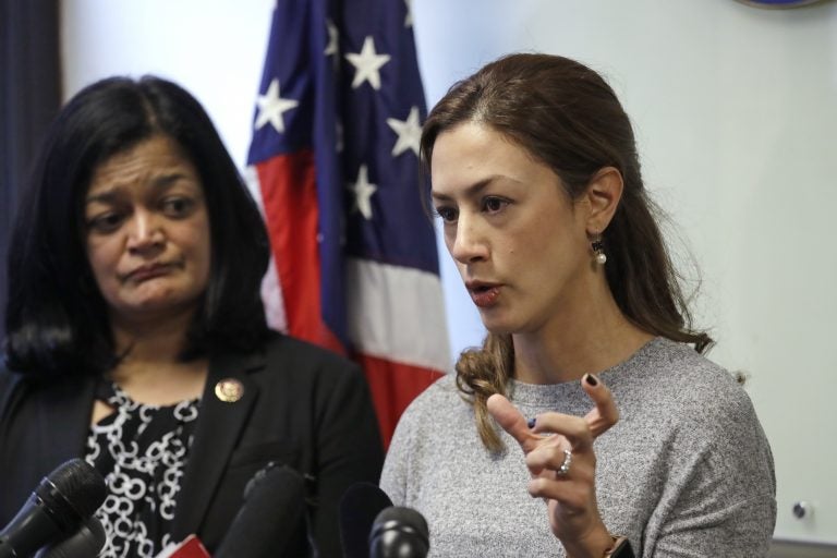 Rep. Pramila Jayapal, D-Wash., looks on as Negah Hekmati talks about her hours-long delay returning to the U.S. from Canada with her family days earlier, at a news conference on Monday. (Elaine Thompson/AP Photo)
