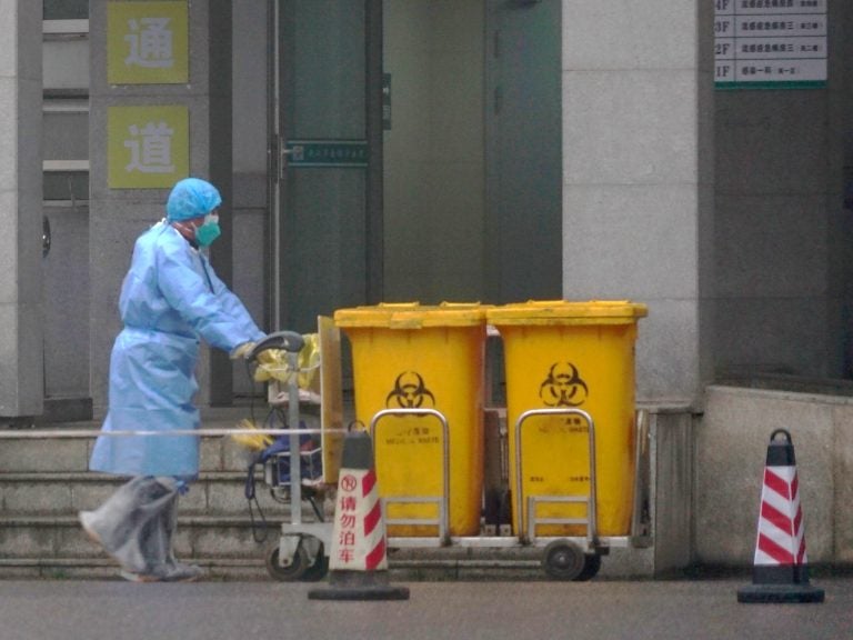 As more cases continue to be confirmed, health officials and medical works in Wuhan, China, and throughout the country ramp up efforts to contain the spread. (Dake Kang/AP Photo)