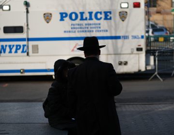 People walk through the Orthodox Jewish section of a Brooklyn neighborhood last month. Tensions remain high in Jewish communities following a series of attacks and incidents in recent weeks. (Spencer Platt/Getty Images)