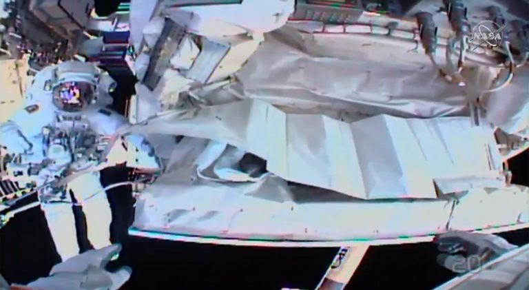 This photo provided by NASA shows the view from NASA's Andrew Morgan's helmet cam as Italian astronaut Luca Parmitano works outside the International Space Station during a spacewalk Saturday. (AP Photo)