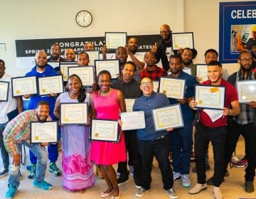 Graduates of a training course sponsored by the Post Bros. celebrate their graduation at the local community center. (Richard Allen New Generation)