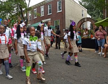 In September 2019, members of the Camden Sophisticated Sisters walk through Waterfront South to perform at the Hearts and Hands Festival sponsored by Sacred Heart Church.  (April Saul for WHYY)