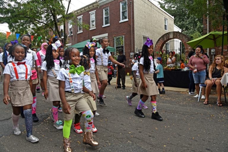 In September 2019, members of the Camden Sophisticated Sisters walk through Waterfront South to perform at the Hearts and Hands Festival sponsored by Sacred Heart Church.  (April Saul for WHYY)