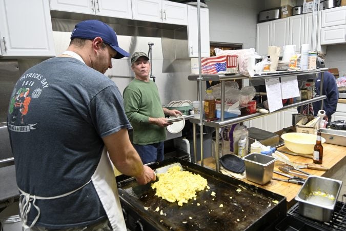 Volunteer firefighters prepare breakfast for the monthly 'All You Can Eat' event at the Social Quarters of Humane Fire Co., in Pottsville, Pa. (Bas Slabbers for Keystone Crossroads)