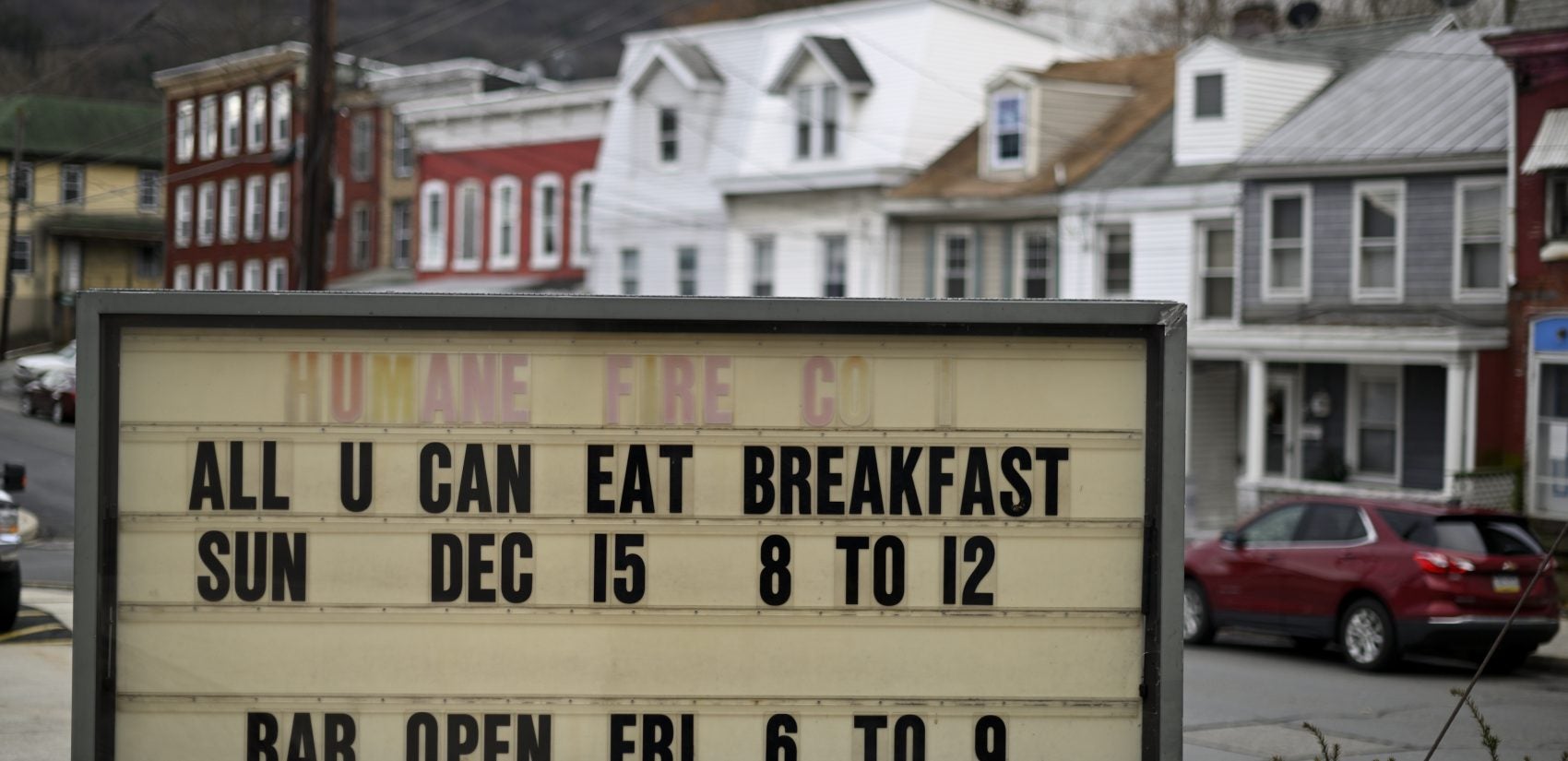 Upcoming social events posted on the board outside Humane Fire Co., in Pottsville, Pa. (Bas Slabbers for Keystone Crossroads)