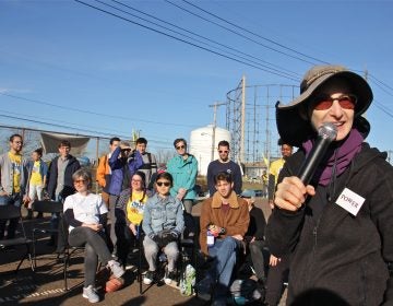 Rabbi Julie Greenberg rallies protesters during a daylong action at PES refinery in South Philadelphia. (Emma Lee/WHYY)