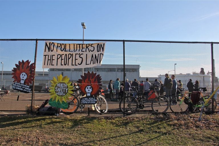 Protesters gather in a parking lot at the Philadelphia Energy Solutions refinery office on Passayunk Avenue in South Philadelphia on Feb. 9, 2020. (Emma Lee/WHYY)