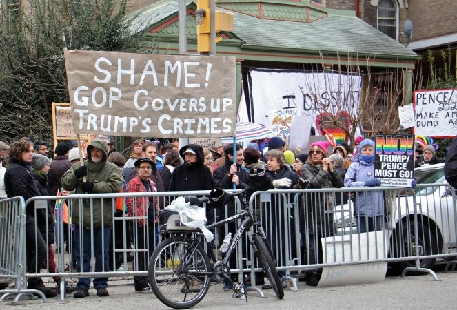 Protesters gather across the street from St. Francis de Sales school, where Vice President Mike Pence was speaking about school choice. (Emma Lee