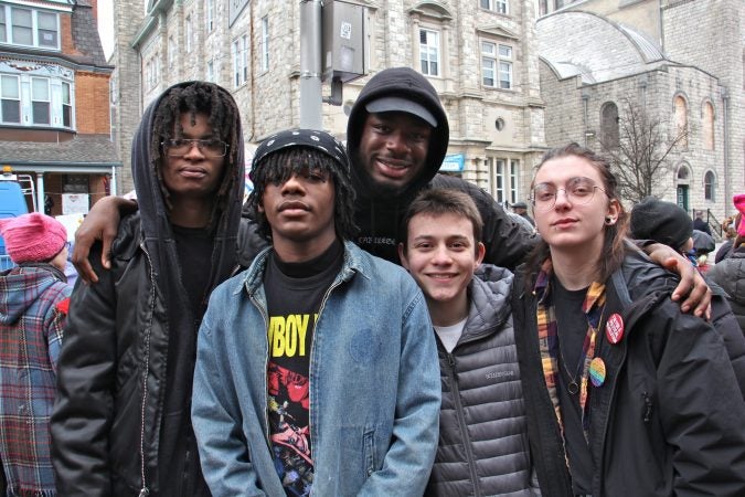 Studemts from the Philly Free School, an alternative school in West Philadelphia, attend a protest against Vice President Mike Pence, who was speaking at St. Francis de Sales School. They are (from left) Prey Lambert, Miles Conyers, Sabri Stamps, Ivo Linkin and Tobias-Maxwell Steich-Otto. (Emma Lee/WHYY)