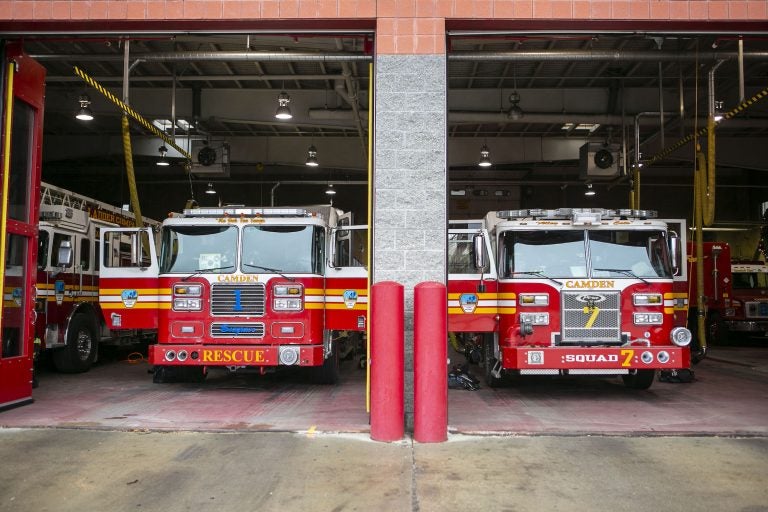 Fire trucks are parked inside Liberty Fire Station on Broadway in Camden, N.J.  (Miguel Martinez for WHYY)