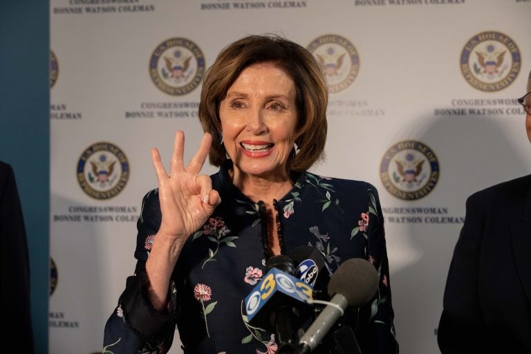 Speaker Nancy Pelosi holds up three fingers in reference to H.R. 3, the Elijah E. Cummings Lower Drug Costs Now Act in Trenton, NJ. (Becca Haydu for WHYY)