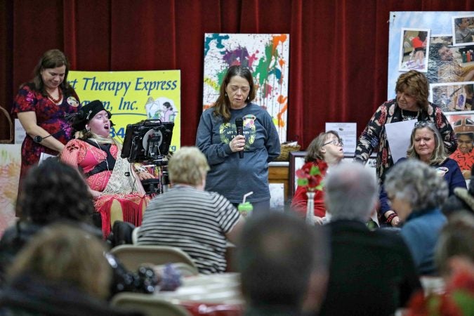 Caregiver Tanya Techentine gives remarks during an art therapy exhibit on Feb. 10, 2020, at The Art Studio in Wilmington, Del. (Saquan Stimpson for WHYY)