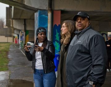 Wysenia Williams, vice president of the advisory council for East Poplar playground (left), with Kira Strong, new executive director of the Rebuild program (center), and Todd Gross, facility manager at the playground. (Kimberly Paynter/WHYY)