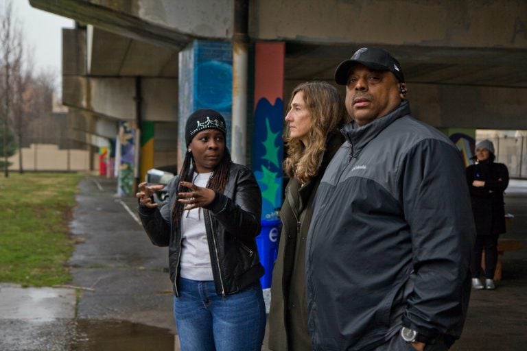 Wysenia Williams, vice president of the advisory council for East Poplar playground (left), with Kira Strong, new executive director of the Rebuild program (center), and Todd Gross, facility manager at the playground. (Kimberly Paynter/WHYY)