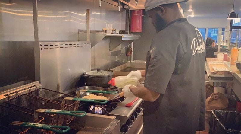 Blackseed Cafe chef Quadir Flippen in the kitchen. (Courtesy of Nashyia Pinder)