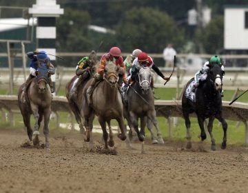 To Honor and Serve, right, with jockey Jose Lezcano aboard, heads to the finish line during the running of the Pennsylvania Derby horse race at Parx Racing, Saturday, Sept. 24, 2011, in Bensalem, Pa. (Alex Brandon / AP Photo)