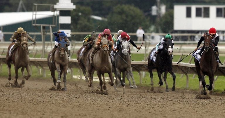 To Honor and Serve, right, with jockey Jose Lezcano aboard, heads to the finish line during the running of the Pennsylvania Derby horse race at Parx Racing, Saturday, Sept. 24, 2011, in Bensalem, Pa. (Alex Brandon / AP Photo)