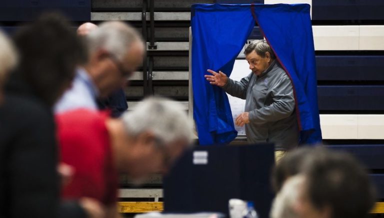 A voter steps from the voting booth after casting his ballot in Doylestown, Pa., Tuesday, Nov. 6, 2018. (Matt Rourke/AP Photo)