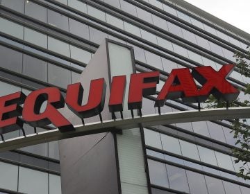 FILE - This July 21, 2012, file photo shows signage at the corporate headquarters of Equifax Inc. in Atlanta. The deadline to seek cash payments and claim free services as part of Equifax's $700 million settlement over a massive data breach is Wednesday, Jan. 22, 2020. (AP Photo/Mike Stewart, File)