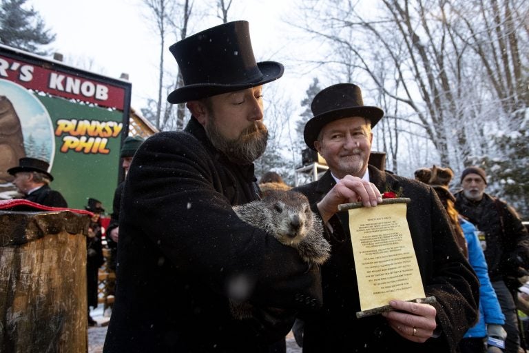 Groundhog Club co-handler Al Dereume holds Punxsutawney Phil, the weather prognosticating groundhog, during the 134th celebration of Groundhog Day on Gobbler's Knob in Punxsutawney, Pa. (Barry Reeger/AP Photo)