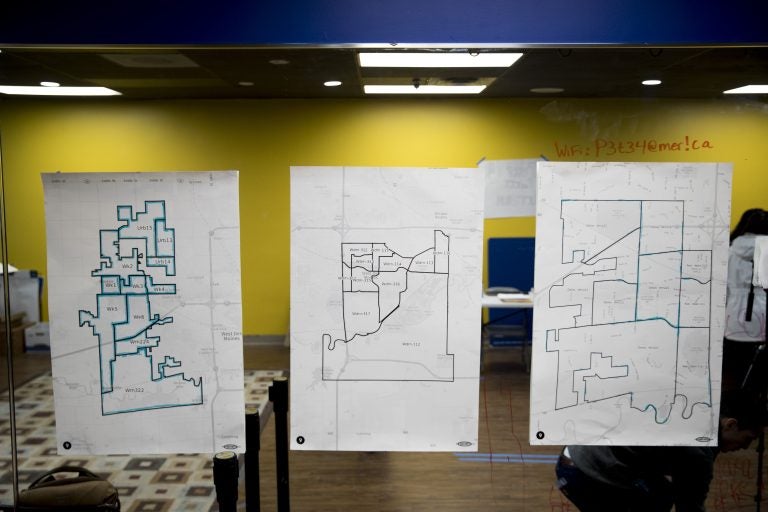 Maps are displayed on the wall of a campaign office for Democratic presidential candidate former South Bend, Ind., Mayor Pete Buttigieg on the day of the Iowa Caucus, Monday, Feb. 3, 2020, in West Des Moines, Iowa. (AP Photo/Andrew Harnik)