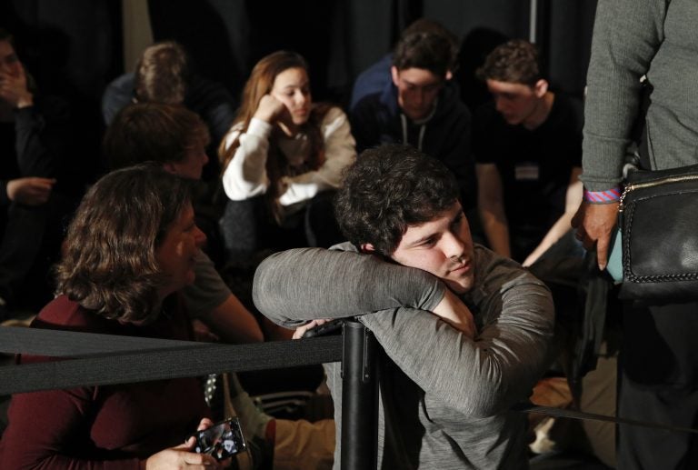 People wait for results at a caucus night campaign rally for democratic presidential candidate former Vice President Joe Biden on Monday, Feb. 3, 2020, in Des Moines, Iowa. (AP Photo/John Locher)