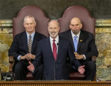 Pennsylvania Gov. Tom Wolf delivers his 2020-21 budget address in the House of Representatives as Speaker Mike Turzai, left, and Lt. Gov. John Fetterman look on, Tuesday, Feb. 4, 2020, in Harrisburg, Pa. (Joe Hermitt/PennLive/The Patriot-News via AP)