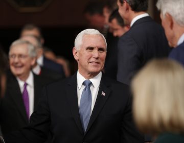 Vice President Mike Pence, center, arrives with Senate Majority Leader Mitch McConnell of Ky., left, before President Donald Trump arrives to deliver his State of the Union address to a joint session of Congress in the House Chamber on Capitol Hill in Washington, Tuesday, Feb. 4, 2020.  (Leah Millis/Pool via AP)