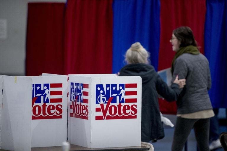 Residents arrive to vote in the New Hampshire Primary at Bishop O'Neill Youth Center, Tuesday, Feb. 11, 2020, in Manchester, N.H. (AP Photo/Andrew Harnik)