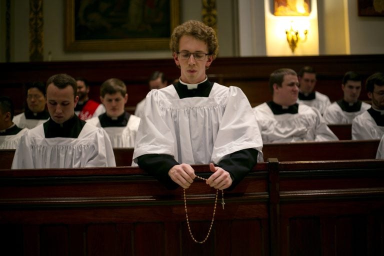 Seminarian Jordan Evans prays the rosary in a chapel at St. Charles Borromeo Seminary in Wynnewood, Pa., on Wednesday, Feb. 5, 2020. After scandals in the Catholic Church, future priests say they hope their examples of piety will restore faith in the clergy. (AP Photo/Wong Maye-E)