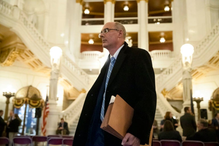 In this Nov. 20, 2019 file photo, former state prosecutor Frank Fina walks in the Pennsylvania Capitol after oral arguments before the Pennsylvania Supreme Court, in Harrisburg, Pa. (Matt Rourke/AP Photo)