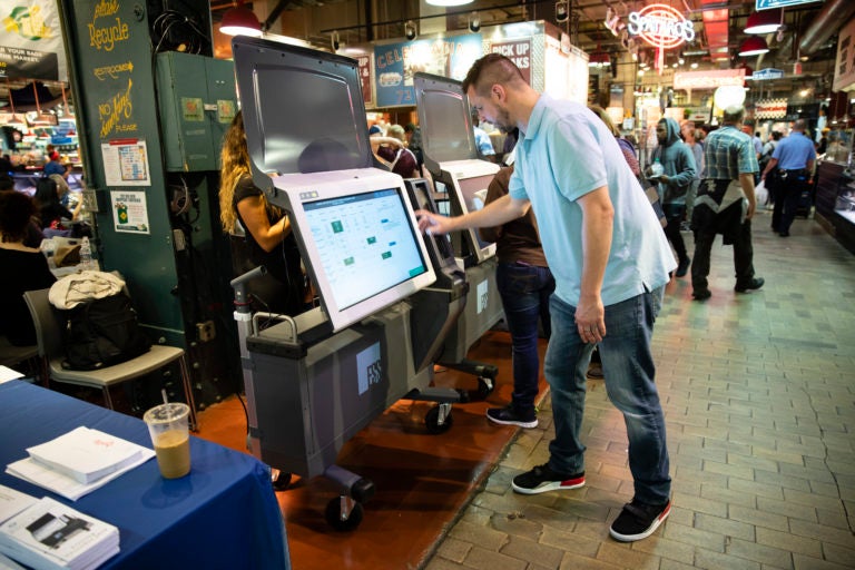 Steve Marcinkus, an Investigator with the Office of the City Commissioners, demonstrates the ExpressVote XL voting machine at the Reading Terminal Market in Philadelphia. (Matt Rourke/AP Photo, File)