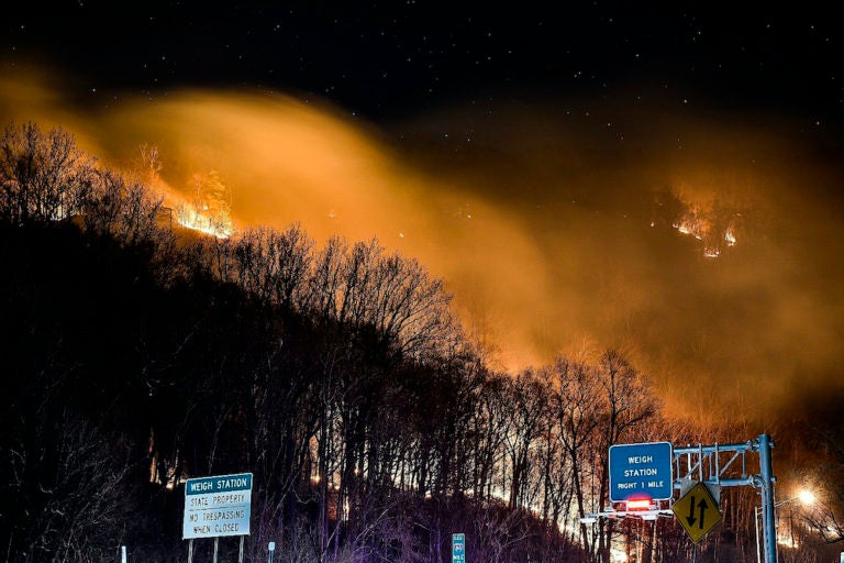 Wildfire near the New Jersey side of the Delaware Water Gap National Recreation Area near Hardwick Township, N.J., Sunday, Feb. 23, 2020. Firefighters from federal and New Jersey agencies were battling the forest fire that broke out in a popular hiking area near the Pennsylvania border. (Adam Polinger via AP Photo)