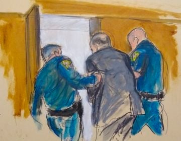 In this courtroom sketch, Harvey Weinstein, center, is led out of Manhattan Supreme Court by court officers after a jury convicted him of rape and sexual assault, Monday, Feb. 24, 2020 in New York. The jury found him not guilty of the most serious charge, predatory sexual assault, which could have resulted in a life sentence in New York. (Elizabeth Williams via AP)