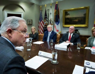 Attorney General Jeff Sessions, left, speaks during a roundtable talks on sanctuary cities hosted by President Donald Trump in the Roosevelt Room of the White House, in Washington, Tuesday, March 20, 2018. Other attendees are, from back center left, Homeland Security Secretary Kirstjen Nielsen, Trump, Immigration and Customs Enforcement Acting Director Thomas Homan and Mary Ann Mendoza. (AP Photo/Manuel Balce Ceneta)