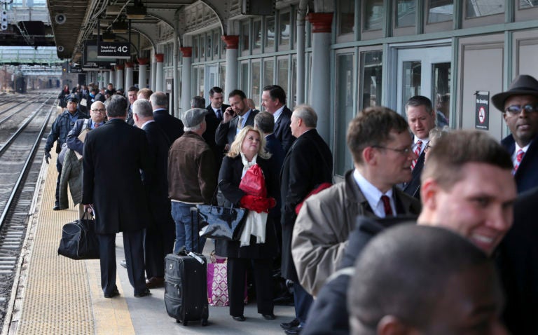 Some of the 1,000 lobbyists, business owners and politicians gather on a platform at the Trenton train station waiting to board a train to Washington, D.C., Thursday, Feb. 16, 2017 in Trenton, N.J. The state Chamber of Commerce's 80th annual trip  nicknamed the 